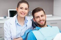 female dentist with man in dental chair general dentistry Saddle Brook, NJ